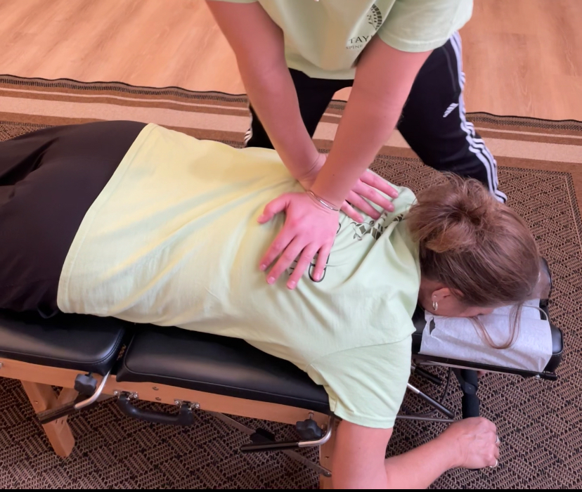Person receiving a chiropractic adjustment